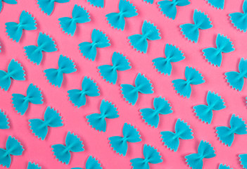 Pattern from blue abstract butterfly on pink background. Creative minimal background.