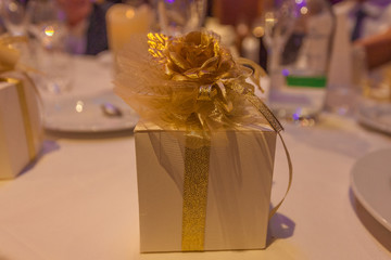 Gift package decorated with gold-colored ribbon