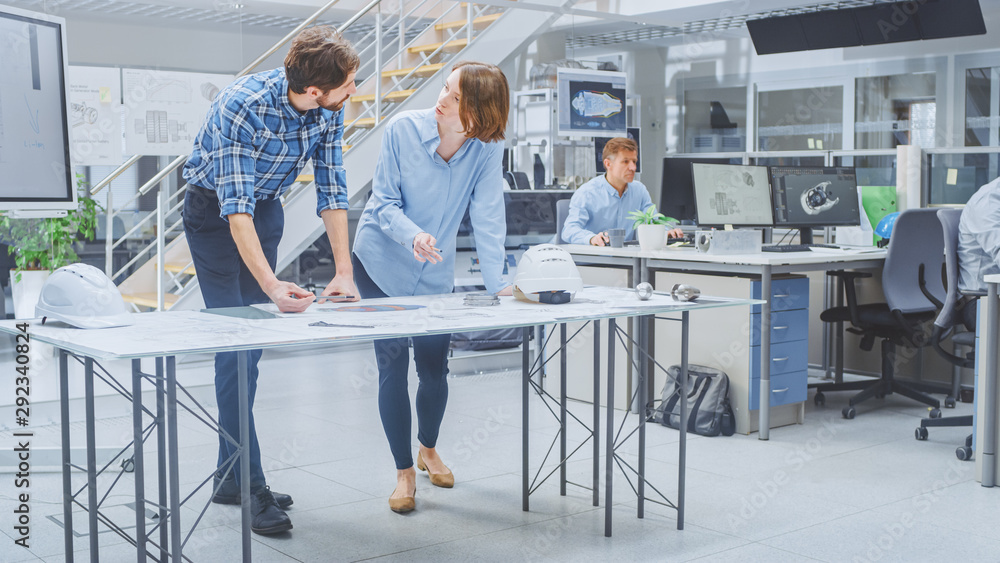 Poster In the Busy Engineering Facility: Diverse Group of Engineers, Technicians, Working on Design for Industrial Engine Prototype. Specialists Talk During Meetings, Work with Drawings, Use Computers