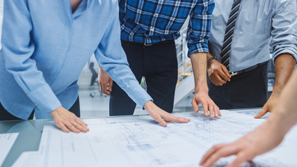 In the Industrial Engineering Facility: Diverse Group of Engineers and Technicians on a Meeting...