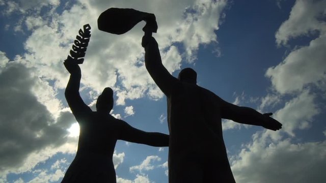 Close-up: Low angle view of statues in city against sky - Novosibirsk, Russia
