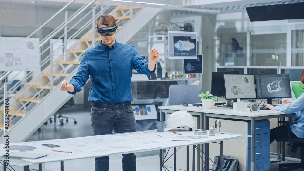 Aufkleber Engineering Software Developer Wearing Virtual Reality Headset Uses Gestures to Interact with Augmented Reality while Designing Industrial Engine Model in Modern Facility. AR Mock-up Concept