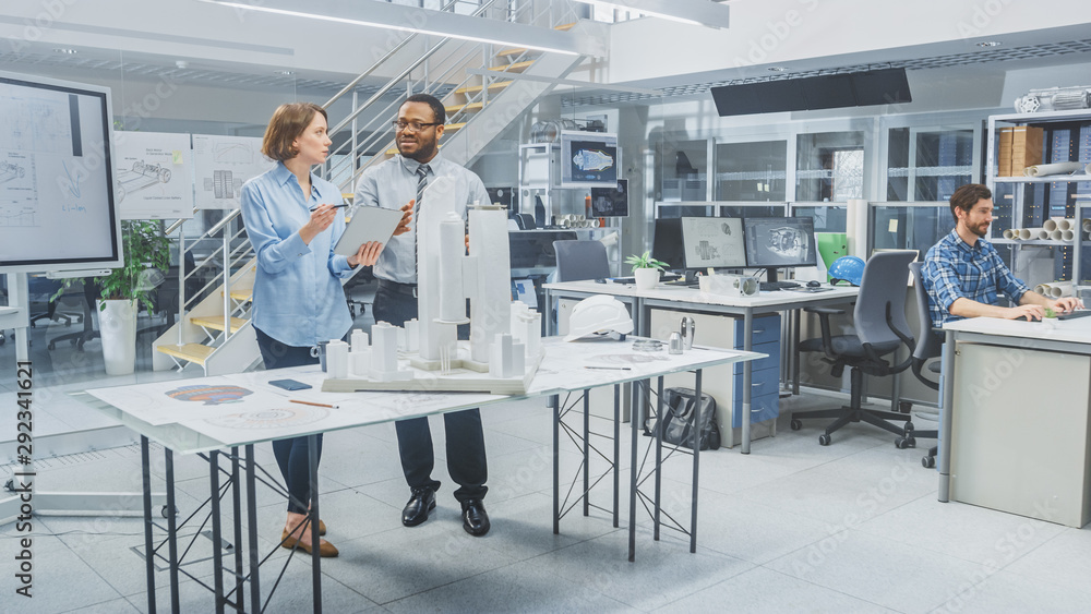 Poster in architectural bureau: team of architects and engineers working on a building complex prototype pr