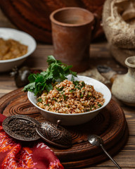Bulgur salad with tomato, mint and parsley
