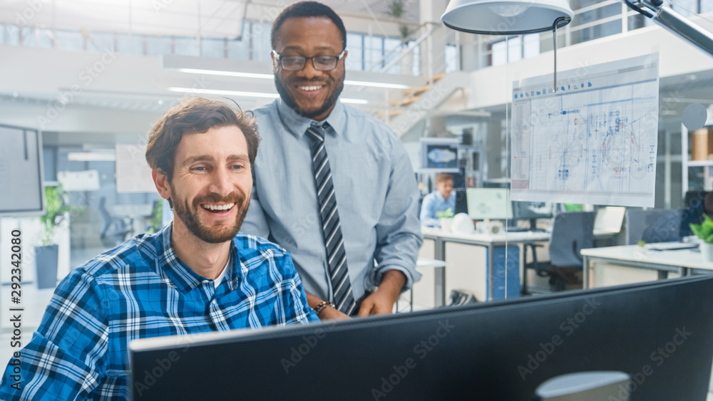Leinwandbilder in the industrial engineering facility: portrait of the handsome male engineer working on desktop co