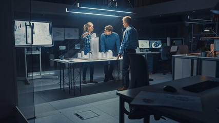 In the Creative Architectural Agency Two Professional Designers Talk with Chief Project Engineer,...