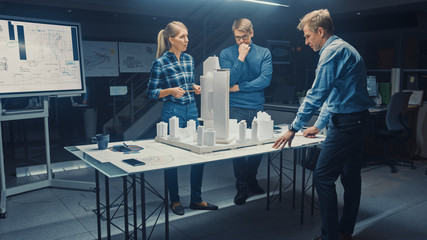 In the Creative Architectural Agency Two Professional Designers Talk with Chief Project Engineer,...