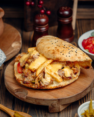 Chicken wrap doner with french fries and vegetables inside