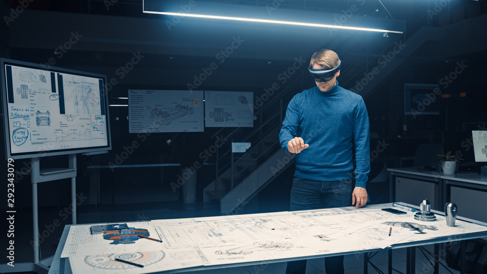 Poster Software Development Engineer Wearing Virtual Reality Headset Gestures and Manipulates Components in Augmented Reality. Engineering Facility Has Desk with Engine and Car Concept Blueprints