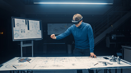 Software Development Engineer Wearing Virtual Reality Headset Gestures and Manipulates Components...