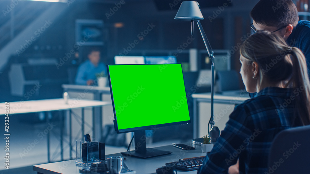 Aufkleber Engineer Working on Desktop Computer, Screen Showing Green Mock-up Screen, Her Male Project Manager Explains Project Specifics. Industrial Design Engineering Facility Office