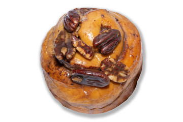 Cinnamon roll topping with walnut on white background
