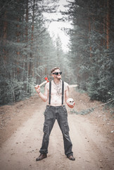 Cannibal Man in glasses with ax and skull