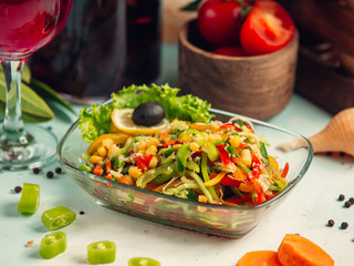 Vegetable salad with bell peppers, cucumber, corn and sesame
