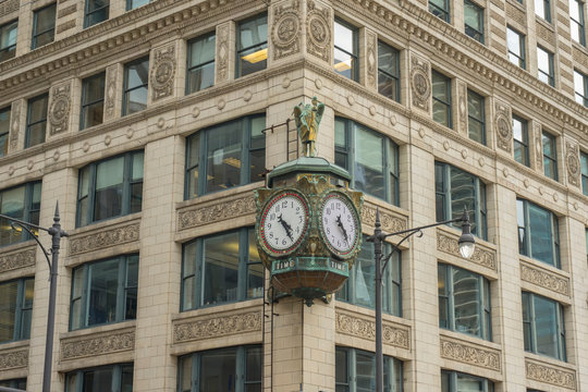 Chicago downtown street view with old fashion clock on building facade