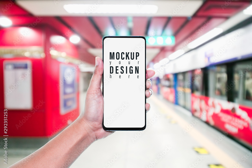 Aufkleber mockup of hand using mobile phone with copy space blank screen for your advertisement with blurred v