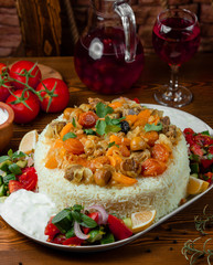 Layered rice pilaff with meat, dried fruits and chesnut