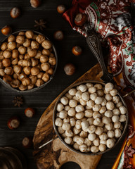 Top view of hazelnut with skin and roasted hazelnut