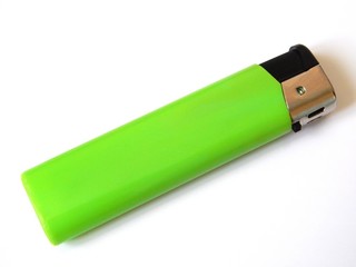 New green plastic lighter isolated on a white background.
