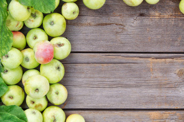 Background with copy space. Summer, autumn background..Apples on a wooden background, top view.
