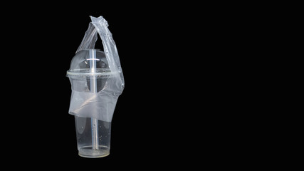 Clear plastic glass with a black background