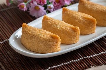 Rice ball wrapped in deep fried tofu pouches (Inari Sushi), Japanese food.