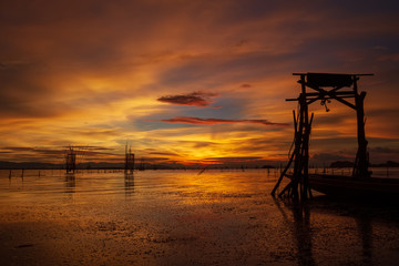 Fototapeta na wymiar Long tail pier In the sunset