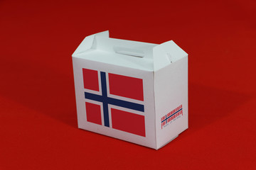 Norway flag on white box with barcode and the color of nation flag on red background. The concept of export trading from Norway.