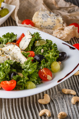 salad provence with blue cheese on wooden table