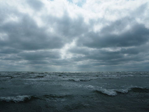 Gray sky over stormy sea