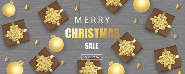 Merry Christmas and Happy New Year. Christmas sale banner in wooden background with gifts box and decoration.