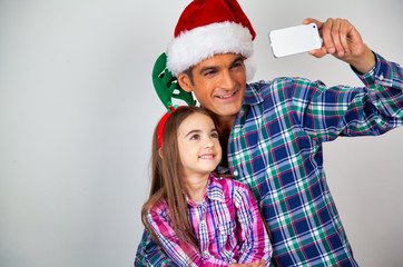 Father with daughter at home for Christmas. Happy family in holiday season