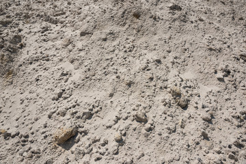 Outdoor pile of white sand texture closeup