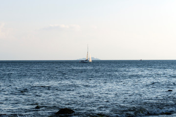 sailing yacht sailing on the beach in sunny weather