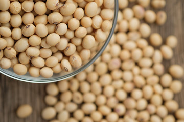 Soybeans are in a cup, placed on a wooden table