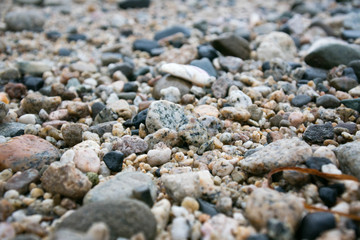 Beach pebbles on sand