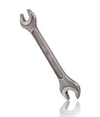old wrench with reflection on isolated white background