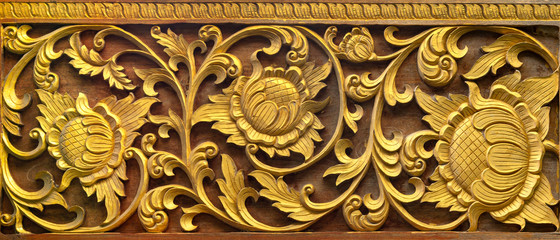 Pattern of flower carved on wood background. Traditional Thai style pattern