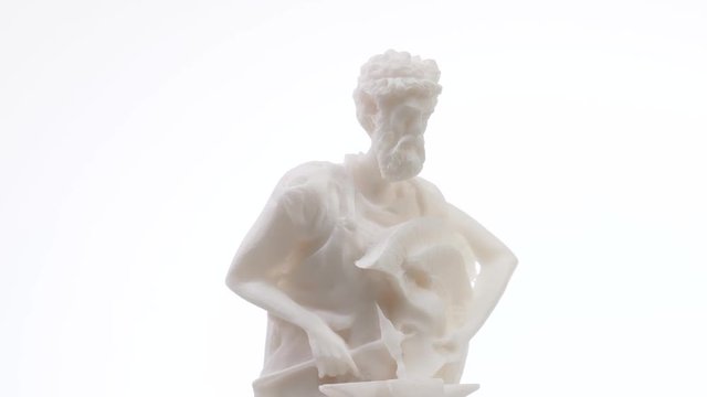 Greek god Hephaestus white marble statue rotating against a white background. Closeup shot
