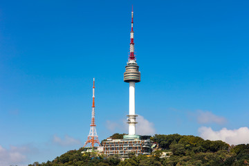 Naklejka premium Seoul tower Located on Namsan Mountain with blue sky white clouds in Seoul, South Korea.