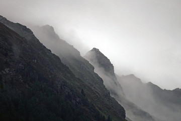 on a rainy day view to the foggy alps