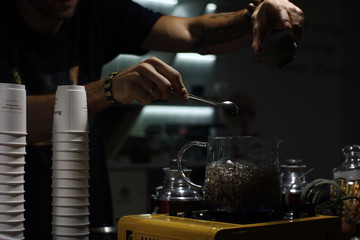 Process brewing tea,tea ceremony,Cup of freshly brewed black tea,warm soft light, darker background.