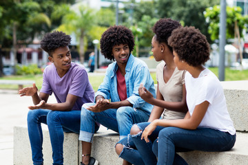 Group of african american young adults in discussion
