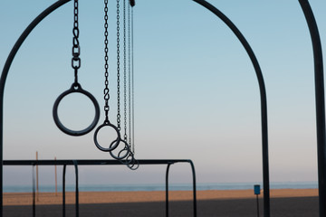 Travelling Rings for exercise at muscle beach jungle gym on in Santa Monica, California at early morning