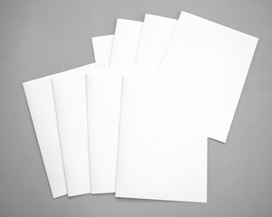 Top view of blank sheet of paper on gray background. mock-ups paper, white paper portrait A4....