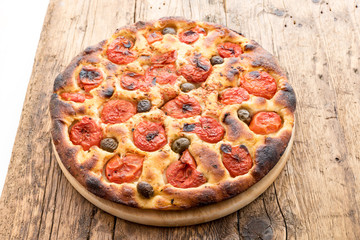 Focaccia typical of Bari Italy with tomatoes and olive