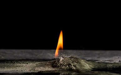 burning sand and a splash of water on a black background, the fifth element