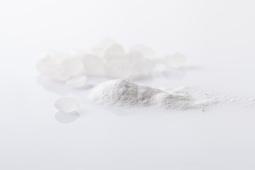 A pile of stabilizer powder on a white background.