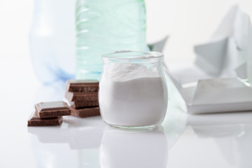 Jar with artificial sweetener aspartame E951 is harmful to health.