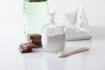 Fototapeta na wymiar Jar with artificial sweetener aspartame E951 is harmful to health.